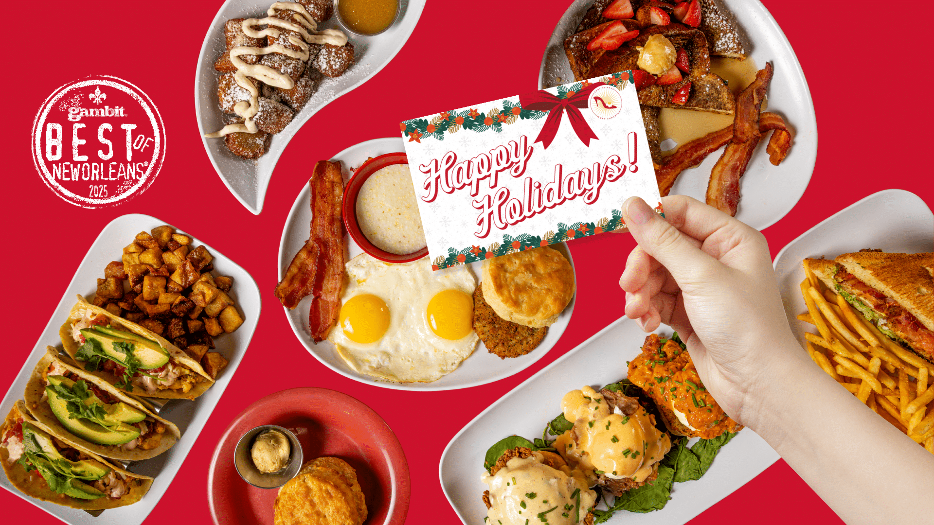 Hand Holding a holiday gift card over a table of food